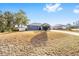 Gray house with a yard and trees in background at 2555 Sw 154Th Place Rd, Ocala, FL 34473