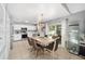 Eat-in kitchen boasts white cabinets and stainless steel appliances at 2555 Sw 154Th Place Rd, Ocala, FL 34473