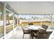 Screened patio with wicker furniture and backyard view at 2555 Sw 154Th Place Rd, Ocala, FL 34473