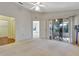 Spacious bedroom with access to a screened-in porch at 26607 Racquet Cir, Leesburg, FL 34748