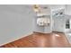 Living room with hardwood floors and a kitchen pass-through at 26607 Racquet Cir, Leesburg, FL 34748