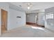 Bright and spacious living room with light walls and carpeted floor at 26607 Racquet Cir, Leesburg, FL 34748