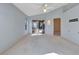 Spacious Primary bedroom with light walls and carpeted floors at 26607 Racquet Cir, Leesburg, FL 34748