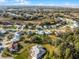 Aerial view of Highland Lakes community, showcasing homes and landscape at 27039 Racquet Cir, Leesburg, FL 34748