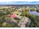 Aerial view of community clubhouse and tennis courts at 27039 Racquet Cir, Leesburg, FL 34748