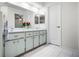 Elegant bathroom with double vanity and updated fixtures at 27039 Racquet Cir, Leesburg, FL 34748