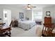Spacious bedroom with a king-size bed and ample natural light at 27039 Racquet Cir, Leesburg, FL 34748