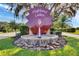 Community entrance sign with fountain at Highland Lakes at 27039 Racquet Cir, Leesburg, FL 34748