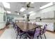 Community kitchen with a long table and chairs at 27039 Racquet Cir, Leesburg, FL 34748