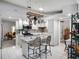 Bright kitchen features stainless steel appliances and an island with seating at 27039 Racquet Cir, Leesburg, FL 34748