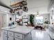Open concept kitchen with island seating and living room view at 27039 Racquet Cir, Leesburg, FL 34748