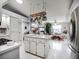 Kitchen with island, stainless steel appliances, and pot rack at 27039 Racquet Cir, Leesburg, FL 34748