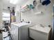 Convenient laundry room with washer, dryer, and extra storage at 27039 Racquet Cir, Leesburg, FL 34748