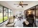 Bright sunroom perfect for dining or relaxing, with access to outdoors at 27039 Racquet Cir, Leesburg, FL 34748