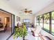 Relaxing sunroom with comfortable seating and plenty of natural light at 27039 Racquet Cir, Leesburg, FL 34748
