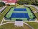 Two well-maintained tennis courts in the community at 27039 Racquet Cir, Leesburg, FL 34748