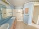 Bathroom featuring double sink vanity, tile floors, and a separated shower at 2707 Privada Dr, The Villages, FL 32162