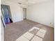 Bedroom with neutral carpet, a ceiling fan and a closet for storage at 2707 Privada Dr, The Villages, FL 32162