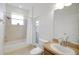 Bathroom with shower/tub combo, single vanity, and exterior access at 2720 Savannah Dr, Leesburg, FL 34748