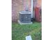 AC unit in backyard near brick wall at 29 Lonesome Pine Trl, Yalaha, FL 34797