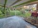 Covered patio with access to a spacious backyard at 29 Lonesome Pine Trl, Yalaha, FL 34797