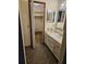 Bathroom with vanity, sink and access to a large closet at 29 Lonesome Pine Trl, Yalaha, FL 34797