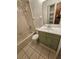 Bathroom features a vanity with storage and a tub shower at 29 Lonesome Pine Trl, Yalaha, FL 34797