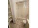 Bathroom with tub, toilet and built-in shelving at 29 Lonesome Pine Trl, Yalaha, FL 34797