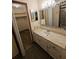 Bathroom boasts a vanity with marble countertop at 29 Lonesome Pine Trl, Yalaha, FL 34797