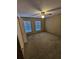Bright bedroom with two windows and ceiling fan at 29 Lonesome Pine Trl, Yalaha, FL 34797