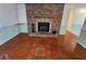 Brick fireplace is a focal point in the living room at 29 Lonesome Pine Trl, Yalaha, FL 34797