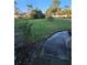 Landscaped front yard with a walkway to the entrance at 29 Lonesome Pine Trl, Yalaha, FL 34797