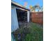 Open garage with storage shelving and space for vehicles at 29 Lonesome Pine Trl, Yalaha, FL 34797