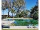 Refreshing community pool with ample seating at 29 Lonesome Pine Trl, Yalaha, FL 34797