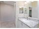 Guest bathroom with single sink vanity and a shower at 317 Emmalee Pl, The Villages, FL 32162