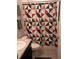 Bathroom featuring a single sink vanity and toilet with a patterned gray, black and red shower curtain at 37030 Lake Overlook Dr, Grand Island, FL 32735