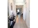 Welcoming foyer with tiled floor and views into the open floor plan and black console table at 37030 Lake Overlook Dr, Grand Island, FL 32735