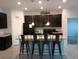 Modern kitchen with granite countertops, stainless steel appliances, and a large island with barstool seating at 37030 Lake Overlook Dr, Grand Island, FL 32735