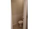 Small toilet room with tiled floors at 37030 Lake Overlook Dr, Grand Island, FL 32735