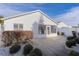 Backyard with a patio, landscaping, and a white fence at 446 Flossmoor Ct, The Villages, FL 32162