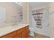 Bathroom with tub, shower, and wood vanity at 446 Flossmoor Ct, The Villages, FL 32162