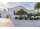 White house with landscaped yard and driveway at 446 Flossmoor Ct, The Villages, FL 32162