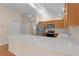 Open concept kitchen with island and stainless steel appliances at 446 Flossmoor Ct, The Villages, FL 32162