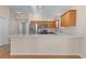 Open concept kitchen with island and stainless steel appliances at 446 Flossmoor Ct, The Villages, FL 32162