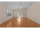 Bright living room with hardwood floors and access to sunroom at 446 Flossmoor Ct, The Villages, FL 32162