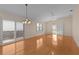 Bright living room with hardwood floors and sliding glass doors at 446 Flossmoor Ct, The Villages, FL 32162