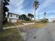 House with driveway and palm trees, located on a tree-lined street at 511 Jessamine Blvd, Daytona Beach, FL 32118