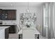 Elegant dining room featuring a marble table and statement art at 571 Bellingham Way, Minneola, FL 34715