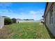 Spacious backyard with grassy lawn and shed at 5756 Lakeside Landings Blvd, Winter Haven, FL 33881