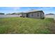 Large backyard with a grassy area at 5756 Lakeside Landings Blvd, Winter Haven, FL 33881